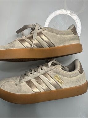 Adidas tan with gold stripes sneakers